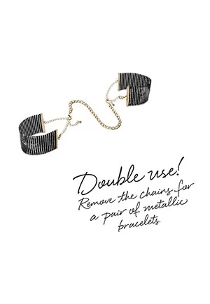 These black bracelets hold a secret: they turn into handcuffs when you wish to. Attached them with the chain with clasps and let the game begin! Its cold and metallic touch turns everything into pleasure!  Measurements: Wrist: Min 15 cm, 5.90 in - Max 24 cm, 9.44 in. Chain: 23 cm, 9.05 in.  Content: Mesh handcuffs and detachable metallic chain. 