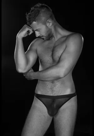 Damon mesh thong belongs to L'Homme, men's basic collection by Patrice Catanzaro. Damon is a transparent mesh thong for men. The fabric is stretchy, flexible and comfortable.  This mesh thong for men closes at the front with a very discreet full zip.  Wear it with t-shirt. 90% Polyamide 10% Elastane. Reference B01211. 1 piece.