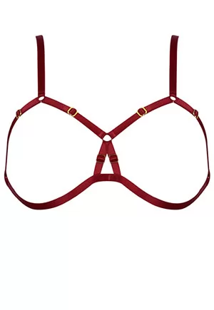 Red lustrous Satin elastic creates this provocative cupless frame bra. Constructed from adjustable straps seductively frame the bust and meet on the center back with 24k gold plated clasp. This classic style is best paired with Ouvert Frame Brief or layered over any bodywear to creative a seductive boudoir look. Handmade in Elf Zhou London atelier