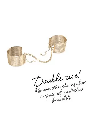 These gold bracelets hold a secret: they turn into handcuffs when you wish to. Attached them with the chain with clasps and let the game begin! Its cold and metallic touch turns everything into pleasure!  Measurements: Wrist: Min 15 cm, 5.90 in - Max 24 cm, 9.44 in. Chain: 23 cm, 9.05 in.  Content: Mesh handcuffs and detachable metallic chain. 