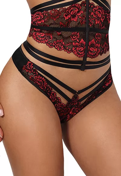 The Axami thong is made of red and black lace and seductive straps on the front. At the back the thong is made of elegant black tulle. 1 piece. Composition: 75% Polyamide, 11% Elastane, 10% Viscose, 4% Cotton. Axami V-10038 thong. Sensual Paradise collection  Coordinate the lace thong with the matching corset bra sold separately.