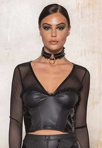 The Tonnerre wetlook top is a short fetish top in thin black transparent mesh on the top and sleeves, in black wetlook on the bust and with shiny vinyl inserts on the sides. The neckline, like a bustier, is underlined by a lace edging.  Coordinate the Tonnerre wetlook top with the Tonnerre chaps and the Tonnerre thong, sold separately, for a total fetish...