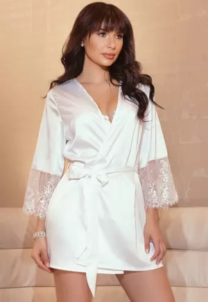 Stretch white satin is the epitome of seduction. Featuring eyelash lace trim this robe is best in class. Soft stretch satin,Eyelash lace sleeves,Inner ties,Features fabric sash. White. OS size. White