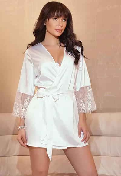 Stretch white satin is the epitome of seduction. Featuring eyelash lace trim this robe is best in class. Soft stretch satin,Eyelash lace sleeves,Inner ties,Features fabric sash. White. OS size. White