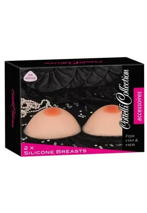 Prothèses externes de seins en silicone de 400 grammes chacune, de coloris chair, avec mamelons réalistes. Prothèses mammaires externes à placer dans un soutien gorge. La matière silicone prend la température du corps à son contact. La forme est étudiée pour une forme naturelle. 1 paire.