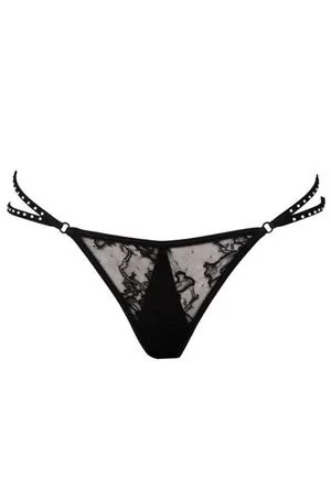 Le String Guimauve est conçu dans une magnifique dentelle florale Française, et s'illumine par des doubles brides rehaussées de cristaux brillants Swarovski.  La dentelle transparente inclut un triangle de lycra pour dissimuler subtilement l'intimité.  À l'arrière du string, les brides rejoignent des noeuds en satin piqués d'un cristal chacun....